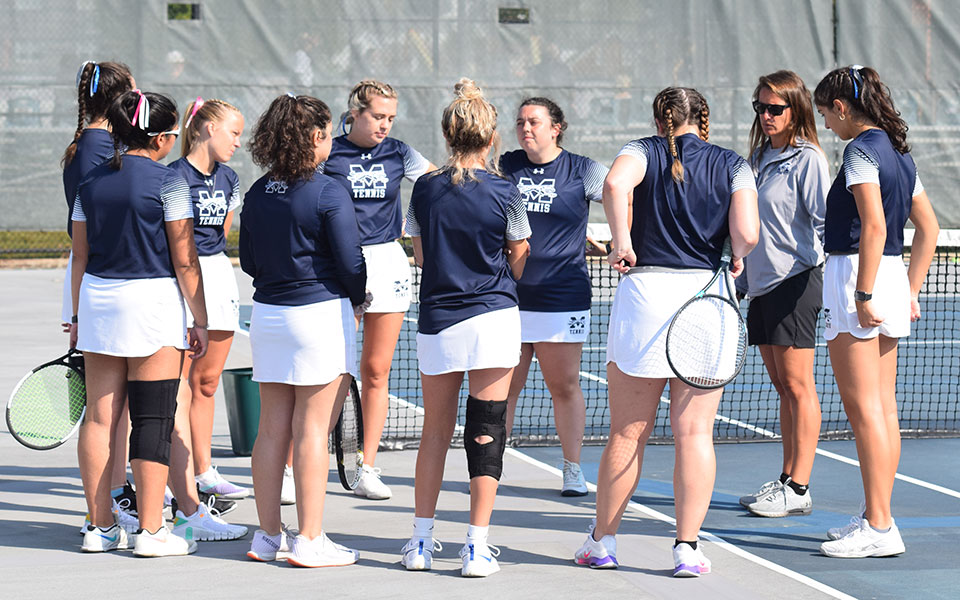 The Greyhounds talk before a match versus Cedar Crest College at Hoffman Courts in October 2021.