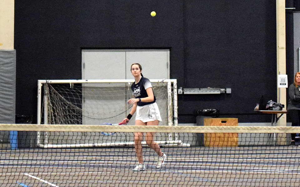 Sophomore Mara Stapleton returns a shot in doubles action in the Greyhounds' match versus Penn State Abington in Timothy Breidegam Fieldhouse. Photo by Ashley Rodrigues '25