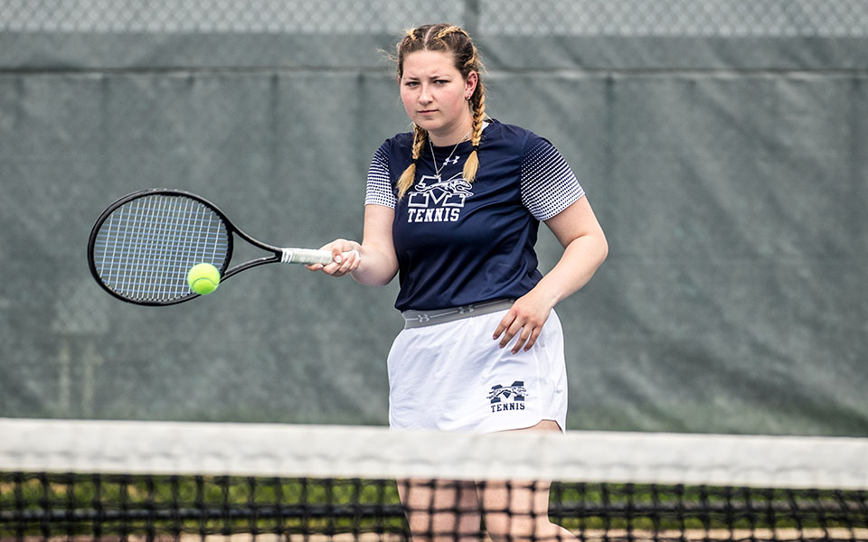 Sophomore Emily Masters returns a shot at Hoffman Courts. Photo by Cosmic Fox Media / Matthew Levine '11