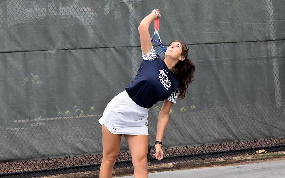 Senior Cristina Merone serves during singles action versus DeSales University at Hoffman Courts. Photo by L.J. Smith '18