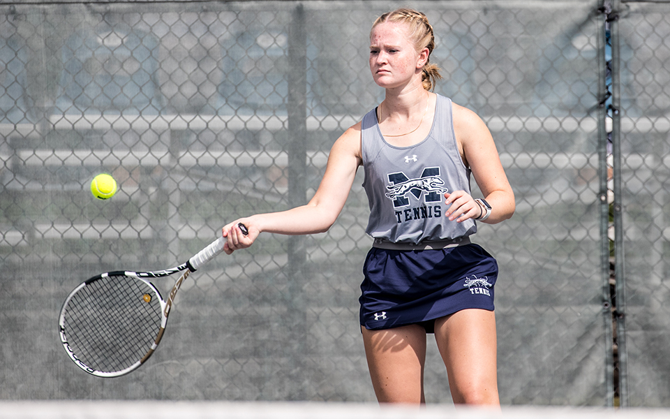 Senior Julianne Cassady hits a forehand in a match versus DeSales University at Hoffman Courts during the fall 2022 season. Photo by Cosmic Fox Media / Matthew Levine '11