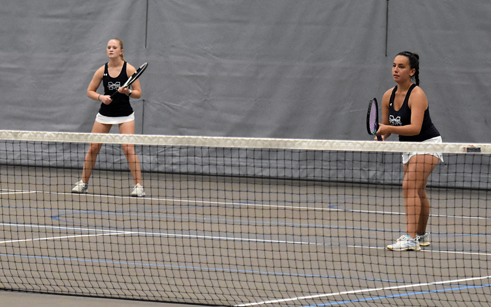 Senior Julianne Cassady and freshman Izzy Szmodis wait for a serve in doubles action versus Goucher College in the 2023 Landmark Conference Semifinal match in Timothy Breidegam Fieldhouse. Photo by Brielle Guarente '25