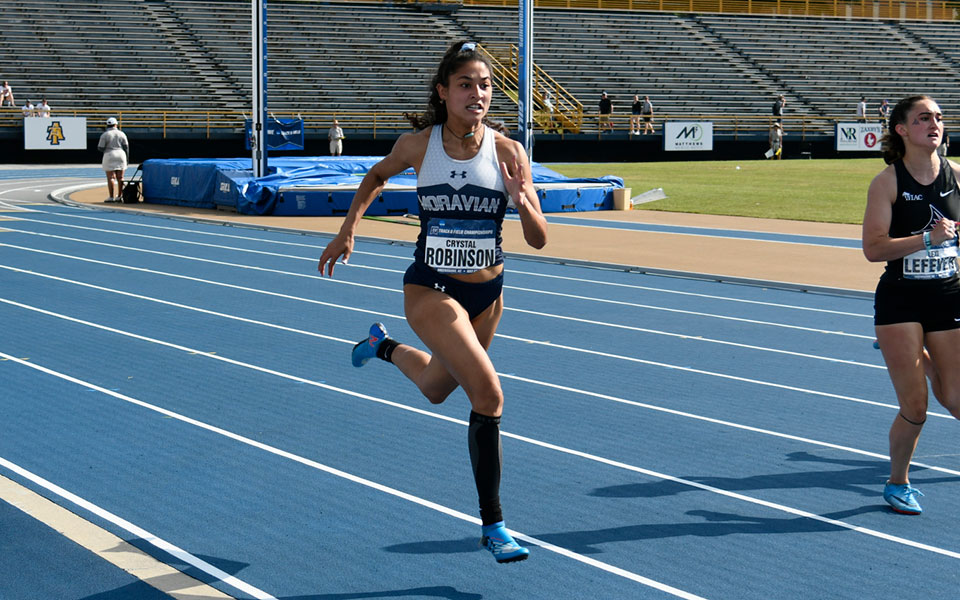 Crystal Robinson '23 runs in the preliminaries of the 200-meter dash at the 2021 NCAA Division III National Championships in Greensboro, North Carolina. Photo courtesy of D3photography