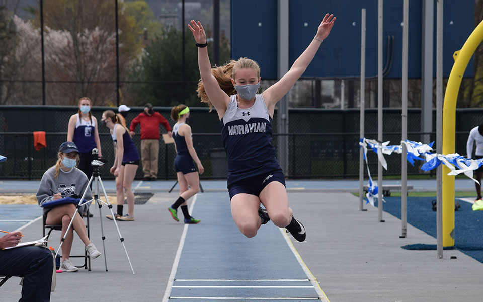 Hanna Leto '24 competes in the long jump during the Greyhound Invitational on April 10 at Timothy Breidegam Track.