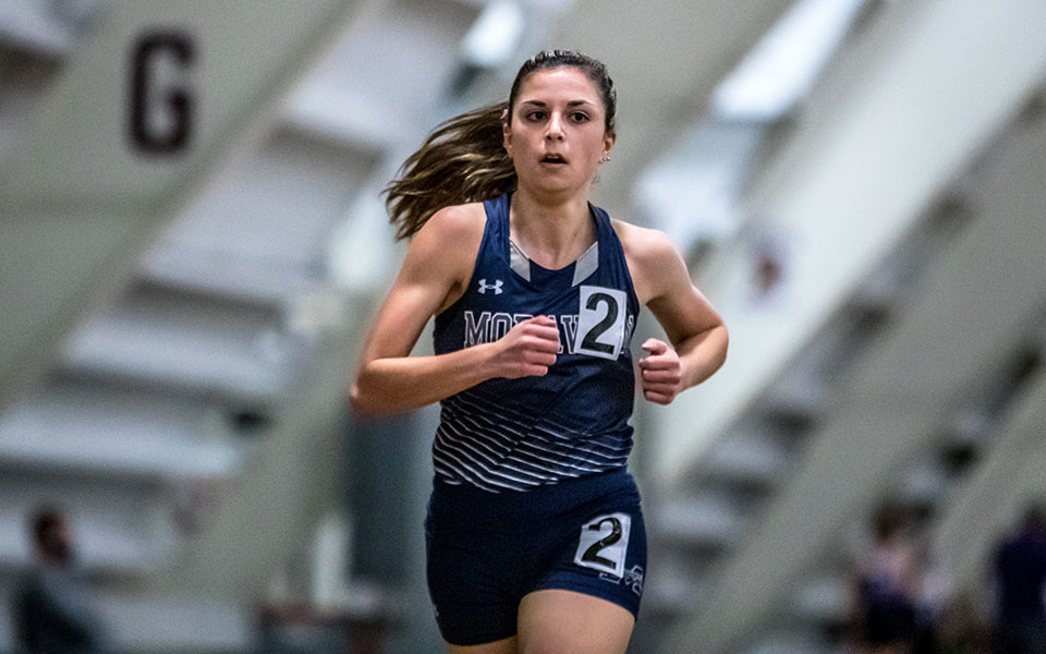 Senior Natalie Stabilito runs in the 3K at the Moravian Indoor Meet at Lehigh University's Rauch Fieldhouse. Photo by Cosmic Fox Media / Matthew Levine '11