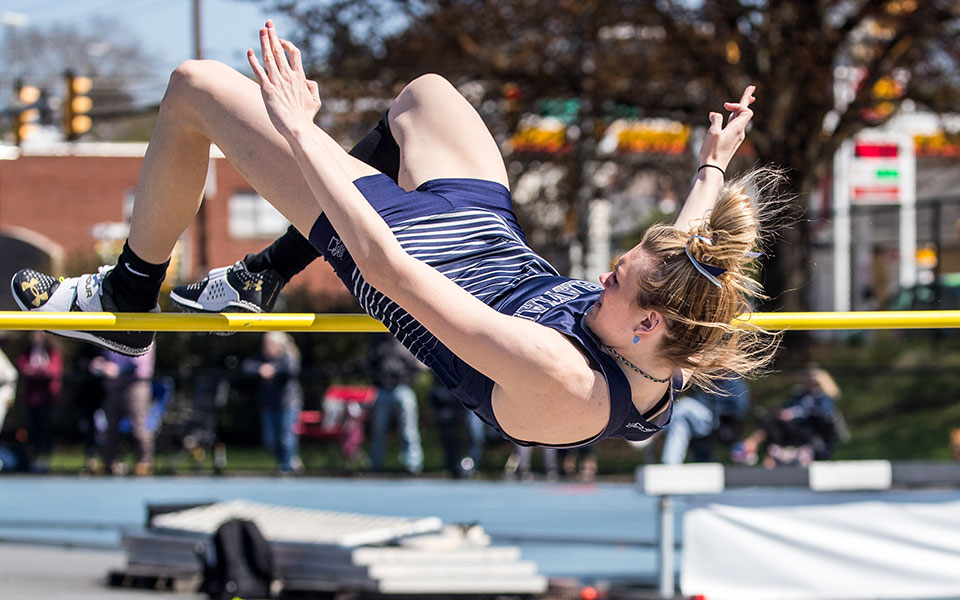 Sophomore Lexi Groff ties the school record in the high jump at the Greyhound Invitational at Timothy Breidegam Track earlier this season. Photo by Cosmic Fox Media / Matthew Levine '11