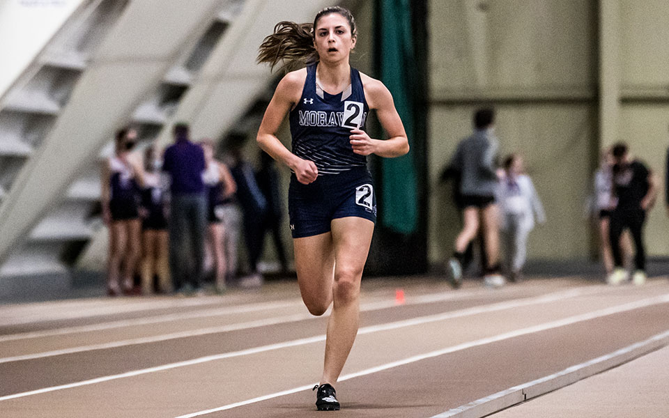 Senior Natalie Stabilito comes into the finish line in a race at the Moravian Indoor Meet competed at Lehigh University's Rauch Field House in January 2022. Photo by Cosmic Fox Media / Matthew Levine '11