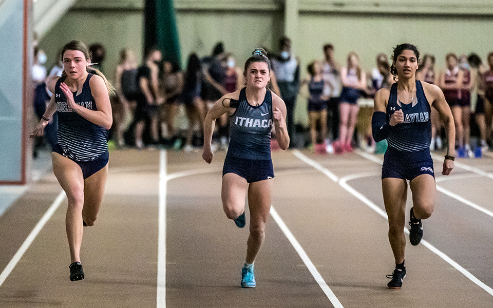 Sophomore Abby Giamoni and senior Helen Davis run in the 60-meter dash during the Moravian Indoor Meet at Lehigh University's Rauch Fieldhouse in January 2022. Photo by Cosmic Fox Media / Matthew Levine '11