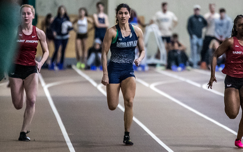 Senior Helen Davis races in the finals of the 60-meter dash during the Moravian Indoor Meet at Lehigh University's Rauch Fieldhouse earlier this season. Photo by Cosmic Fox Media / Matthew Levine '11