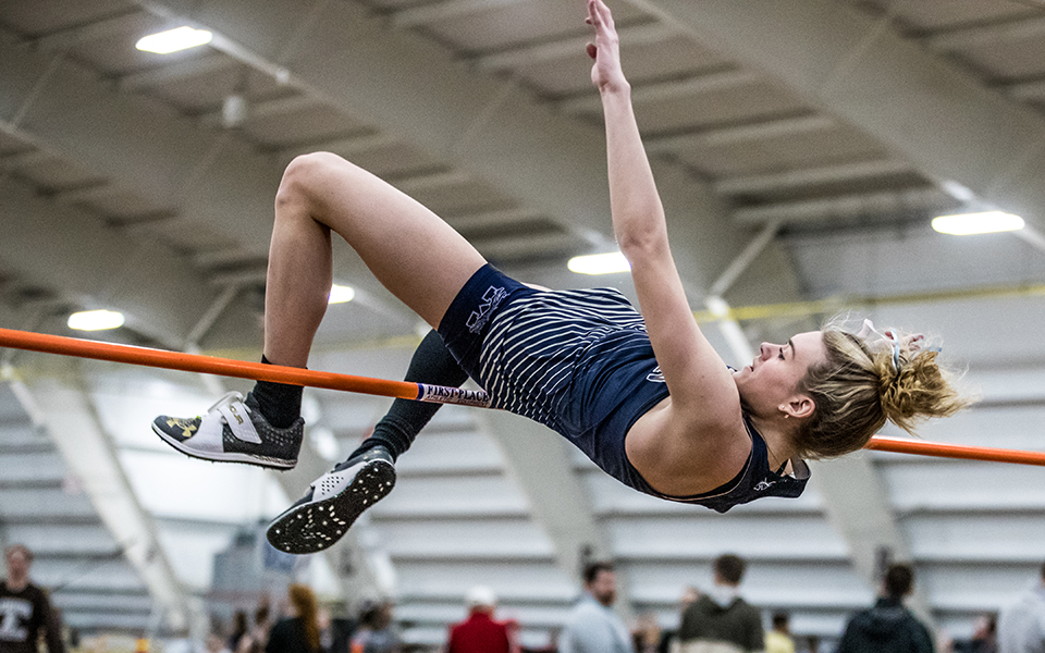 Junior Lexi Groff clears the bar in the high jump during the Moravian Indoor Meet at Lehigh University's Rauch Fieldhouse earlier this season. Photo by Cosmic Fox Media / Matthew Levine '11