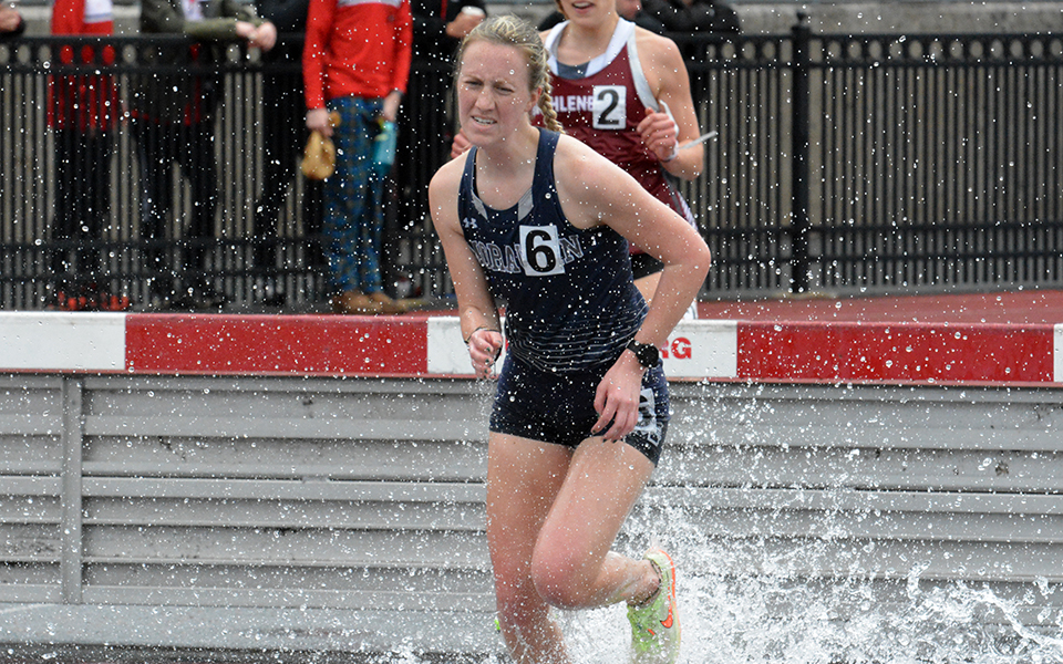 Sophomore Rachael Goodman comes out of the water jump in the 3,000-meter steeplechase during the Muhlenberg College Invitational. Photo courtesy of Muhlenberg College Sports Information