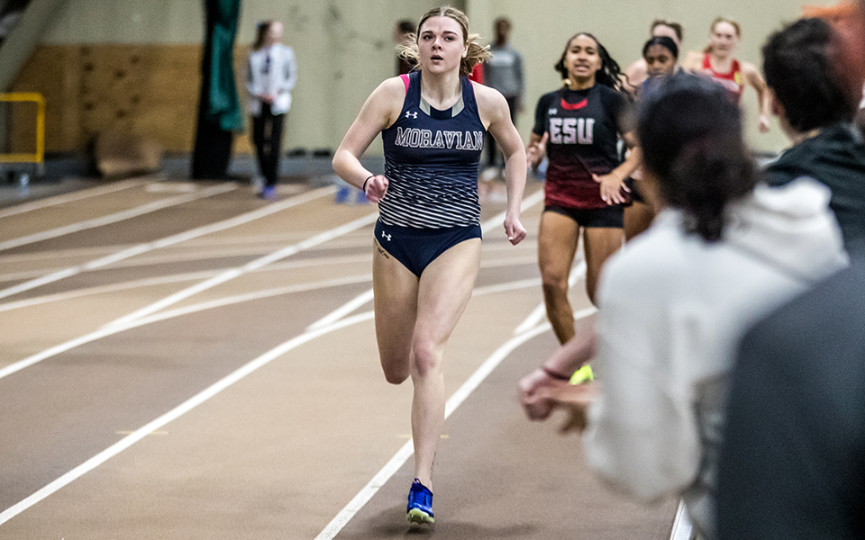 Junior Abby Giamoni races in the 400-meter dash during the Moravian Indoor Meet at Lehigh University's Rauch Fieldhouse. Photo by Cosmic Fox Media / Matthew Levine '11