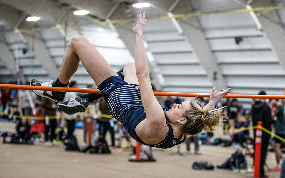 Senior Lexi Groff clears the bar in the high jump at the Moravian Indoor Meet at Lehigh University's Rauch Field House. Photo by Cosmic Fox Media / Matthew Levine '11
