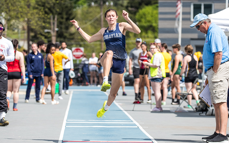 Sophomore Ali Haefele competes in the long jump at the Coach Pollard Invitational during the 2023 season. Photo by Cosmic Fox Media / Matthew Levine '11