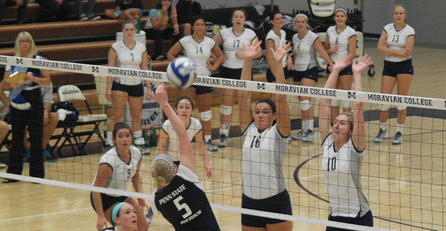 Sophomore Victoria Bobyak (No. 16) and junior Taylor Jennings (No. 10) go up for the block in Moravian's straight-sets win over Penn State-Berks on Wednesday night in Johnston Hall.