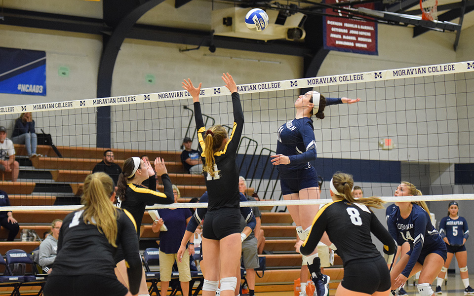 Senior Erin Tiger goes up for a kill in the 2018 season opener versus Baldwin-Wallace University.