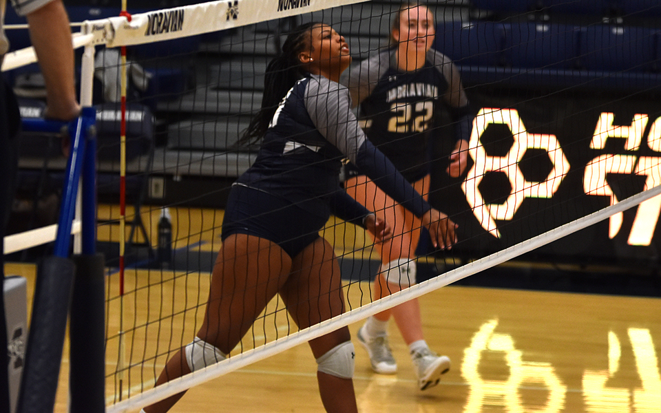 Freshman middle blocker Davana Elysee watches an attack attempt in the second set versus Penn State-Schuylkill in Johnston Hall. Photo by Alex Dillon '26