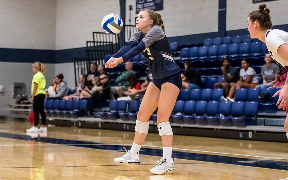 Freshman defensive specialist Sam Love digs a ball in a match versus Centenary (N.J.) University during the 20th Greyhound Premiere Invitational in Johnston Hall. Photo by Cosmic Fox Media / Matthew Levine '11