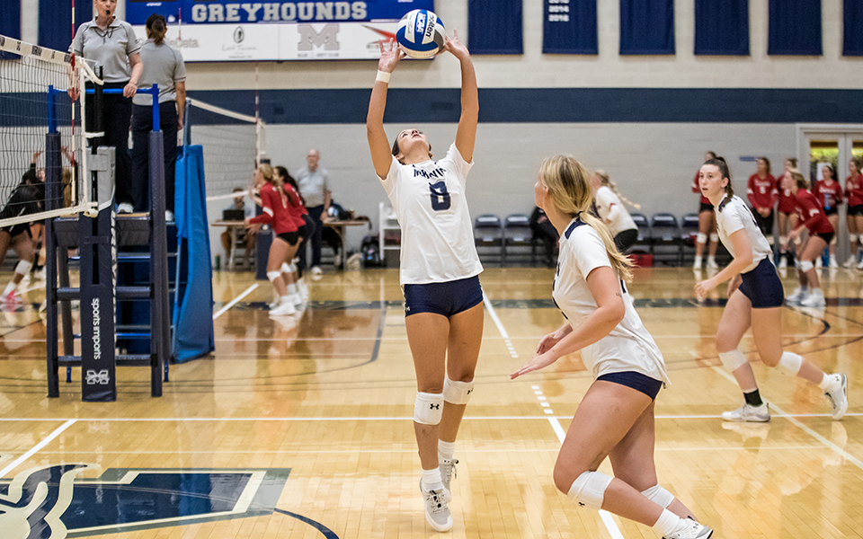 Freshman Molly Hughes sets the ball in a match versus Centenary (N.J.) University during the 20th Greyhound Premiere Invitational in Johnston Hall. Photo by Cosmic Fox Media / Matthew Levine '11