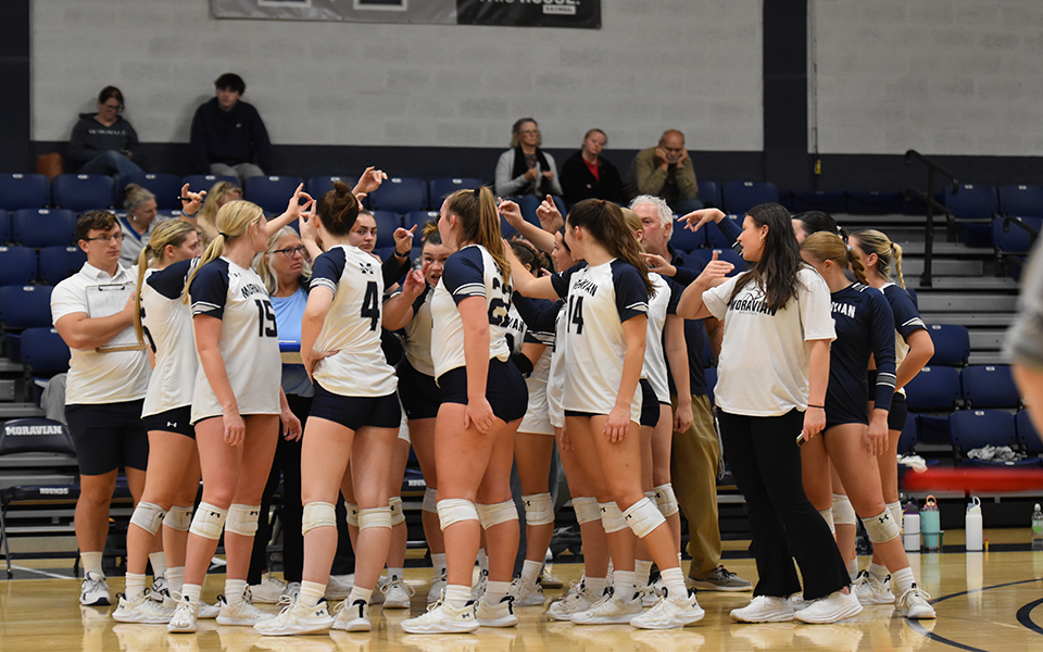 The Greyhounds huddle before the start of a Landmark Conference match versus No. 1 Juniata College in Johnston Hall. Photo by Natalie Osorio '27