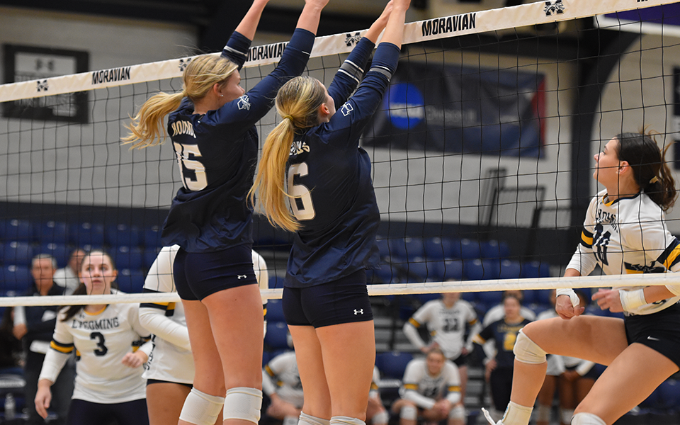 Sophomore Payton Reuber and junior Ally Plitnick go up for a block versus Lycoming College in Johnston Hall this season. Photo by Elena Pitrelli '28