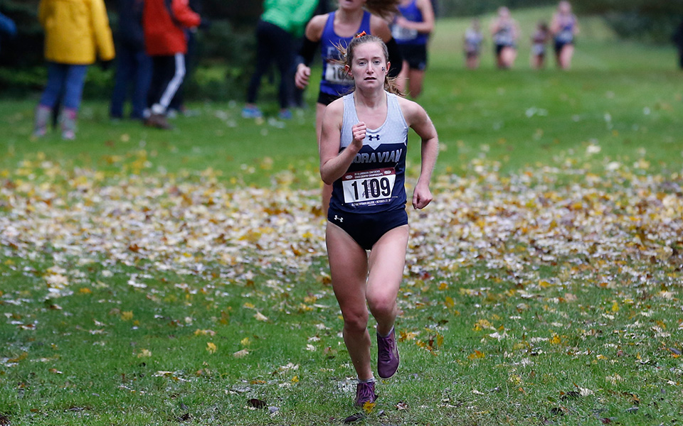Sophomore Natalie Novotni comes into the finish line as the 2018 Landmark Conference Women's Cross Country Champion at Union Canal Tunnel Park. Photo by Elizabethtown College Athletic Communications.