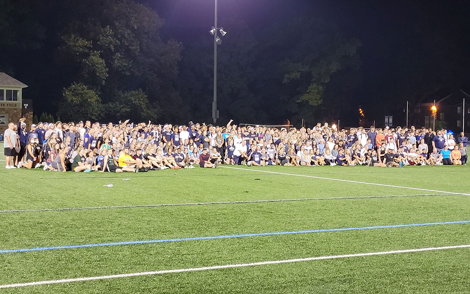 The 2021-22 Greyhounds on John Makuvek Field at the end of the SAAC Kickoff event.