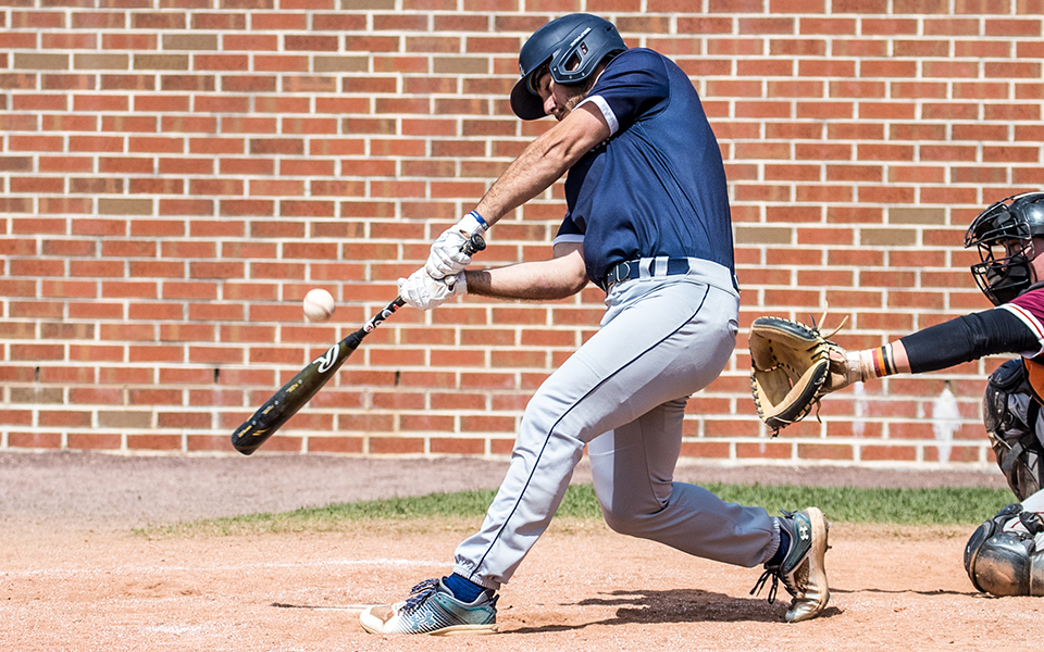 Junior outfielder Nick Henry connects with a pitch in a game versus Susquehanna University at Blue & Grey Field during the 2023 season. Photo by Cosmic Fox Media / Matthew Levine '11