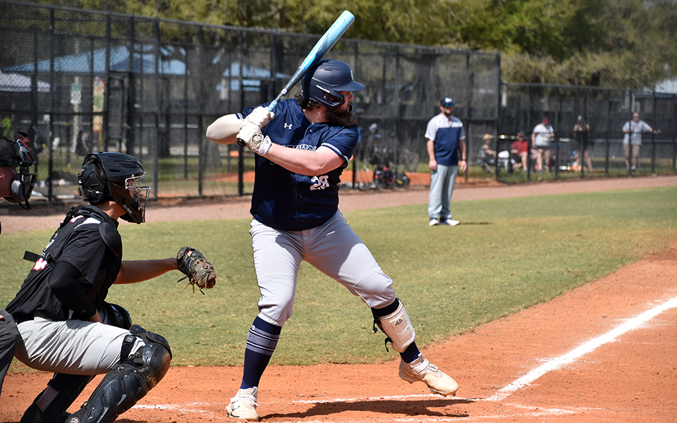 Graduate student first baseman Paul Hamilton gets set to swing versus Rose-Hulman Institute of Technology at Lake Myrtle Park in the RussMatt Invitational in Florida. Photo by Christine Fox