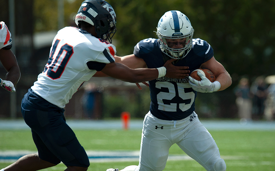 Senior running back Nate Boyle fights for yards on his way to the end zone in the Greyhounds' 58-34 win over Keystone College in the first-ever Landmark Conference game at Rocco Calvo Field. Photo by Brandon Santiago '26