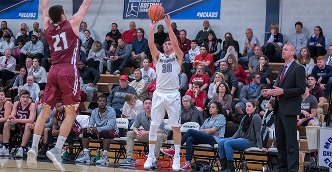 Matt Cardonne '18 launches a three-pointer versus Muhlenberg College in Johnston Hall during the first half in November 2017.