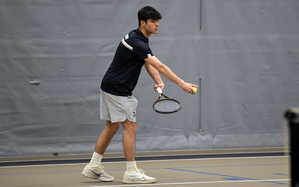 Junior Anthony Ronca gets set to serve in doubles action versus Lycoming College in Timothy Breidegam Fieldhouse. Photo by Christine Fox