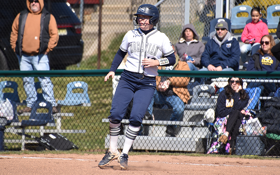 Junior first baseman Lindsey Gawrys rounds first base after a single versus Wilkes University in the opening game at Blue & Grey Field. Photo by Marissa Williams '26