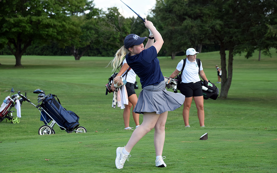 Freshman Ella Oswald tees off during the Elizabethtown College Fall Invitational at the Hershey Country Club. Photo by Christine Fox