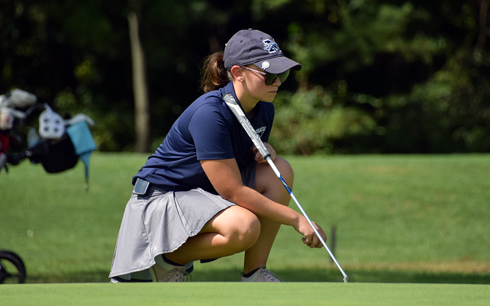 Freshman Alivia Zagra lines up a putt during the Elizabethtown College Invitational at the Hershey Country Club East Course. Photo by Christine Fox