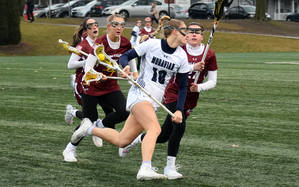 Graduate student attack Brittany Bill races towards the offensive end after controlling a draw control versus rival Muhlenberg College on John Makuvek Field to start the 2023 season. Photo by Grace Nelson '26