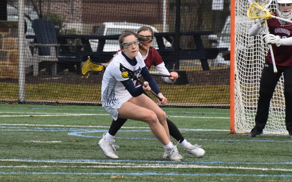 Sophomore midfielder Madi Dippel makes a move towards the net in a match versus Muhlenberg College to begin the 2023 season on John Makuvek Field. Photo by Grace Nelson '26