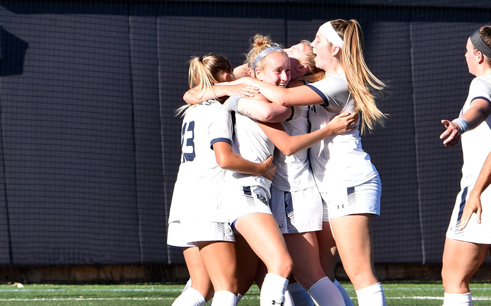 The Greyhounds celebrate a goal by Kylie Hughes versus Lebanon Valley College on John Makuvek Field. Photo by Avery Saladino '24