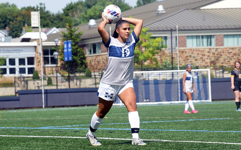 Senior defender Kiara Morales throws the ball in during a non-conference match versus Cedar Crest College on John Makuvek Field this season. Photo by Avery Saladino '24