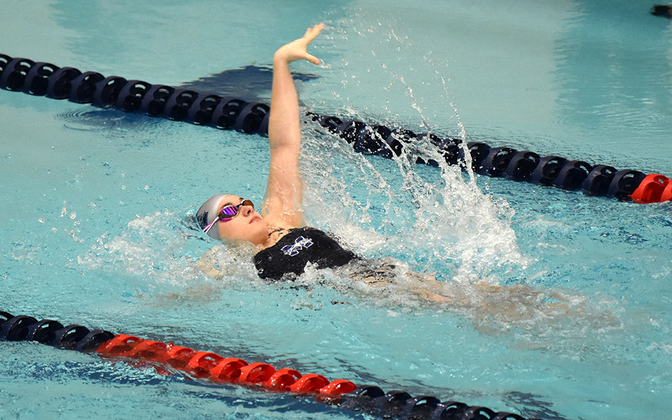 Junior Lydia Devlin swims the backstroke versus Albright College at Liberty High School's Memorial Pool. Photo by Christine Fox