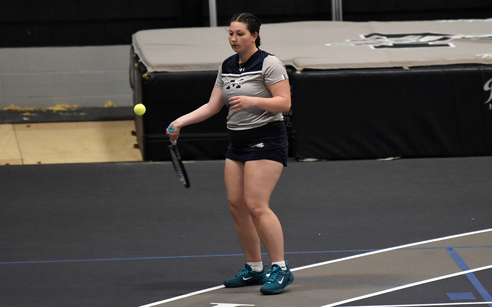 Senior Emily Masters returns a shot in doubles action versus Lycoming College in Timothy Breidegam Fieldhouse. Photo by Ashley Rodrigues '25