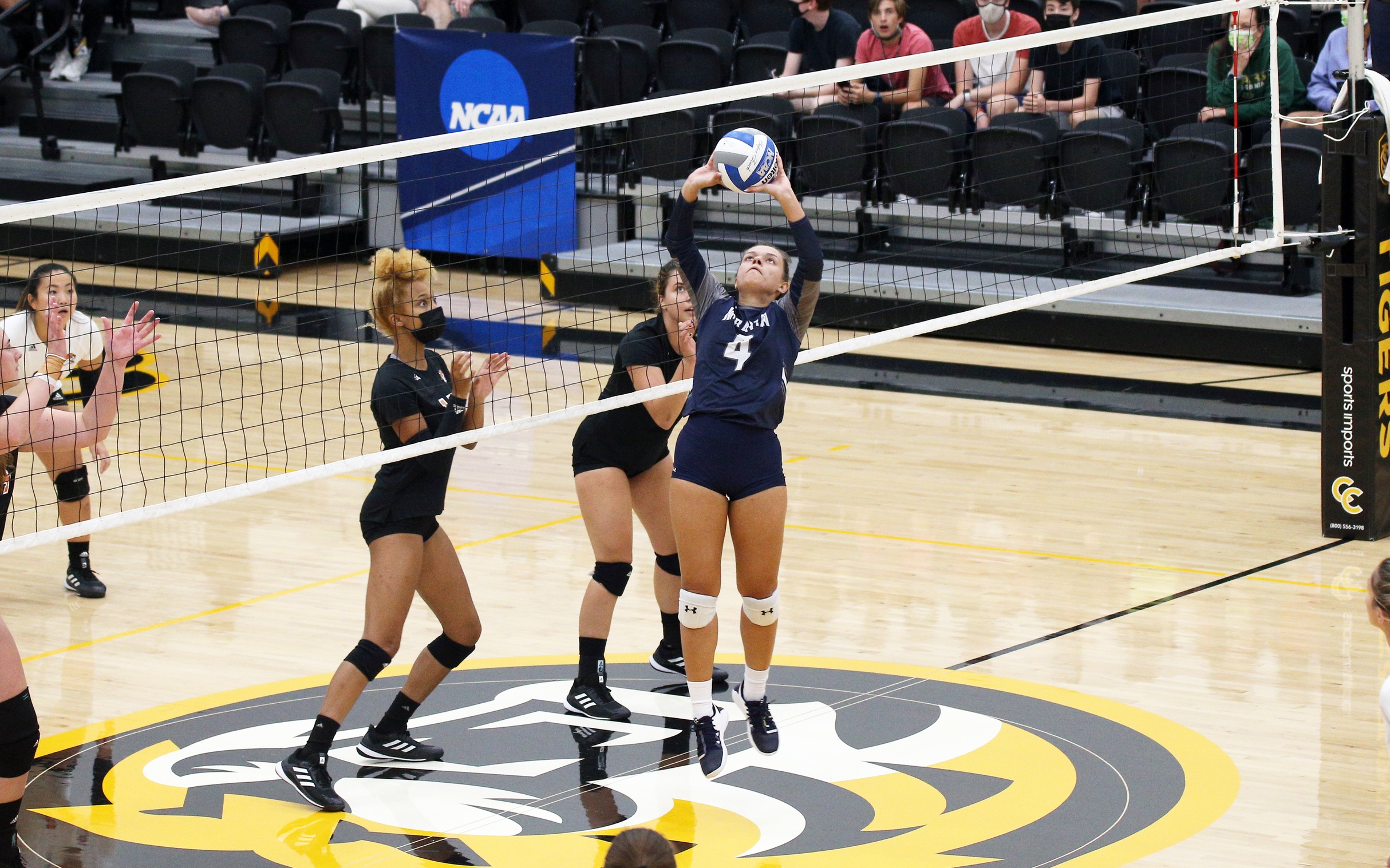 Junior Natalia Matos sets a pass to a teammate during the Spike It Up Classic in Colorado. (Photo courtesy of Charlie Lengal III)