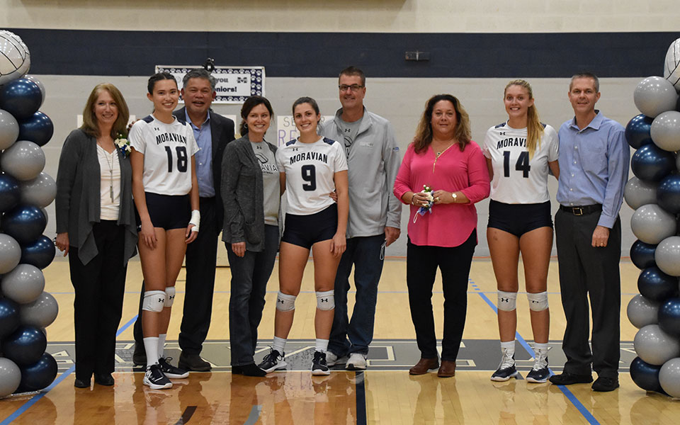 Seniors Renee Mapa, Kirah Dreisbach and Sela Herber and their parents on Senior Night in Johnston Hall before the Greyhounds played The University of Scranton. Photo by Nadia Hassanali '22.