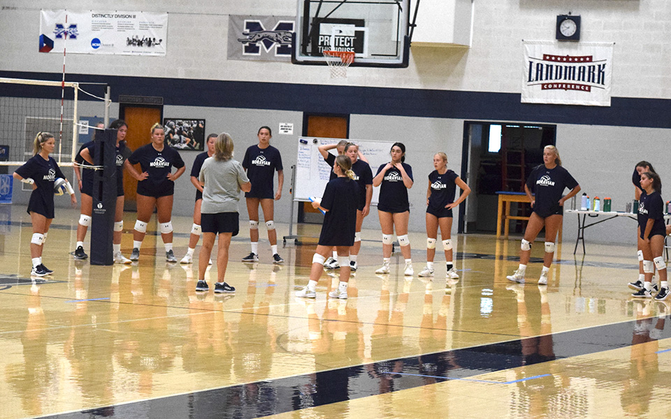 Head Coach Shelley Bauder talks with the Greyhounds during their first practice of the 2021 preseason in Johnston Hall.