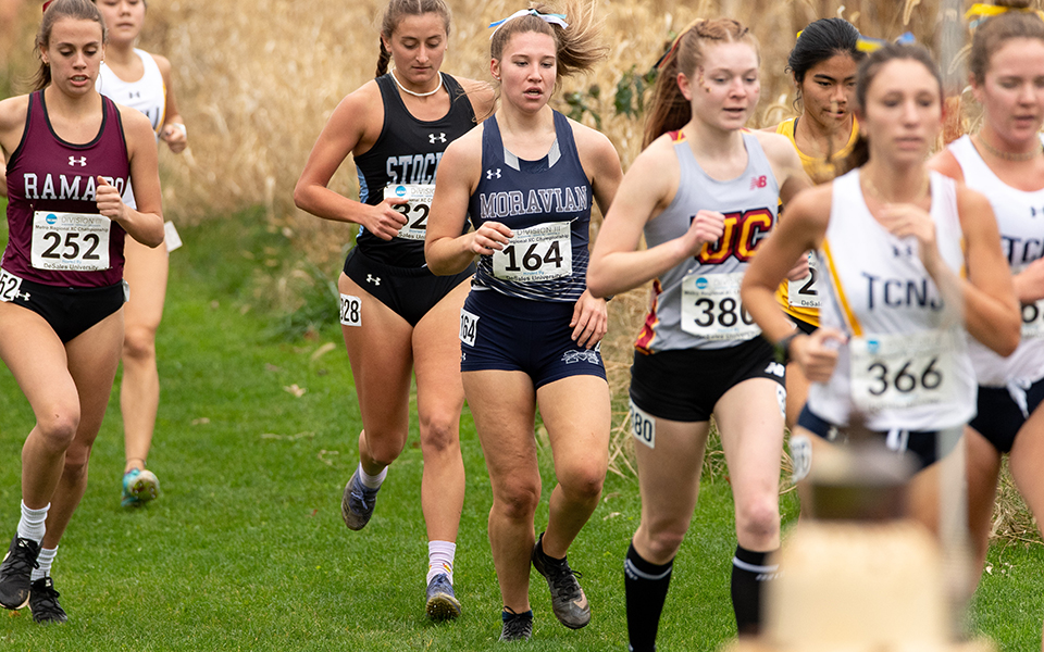 Sophomore Amber Poniktera runs in the pack during the 2022 NCAA Division III Metro Regional at DeSales University. Photo courtesy of DeSales University Athletic Communications